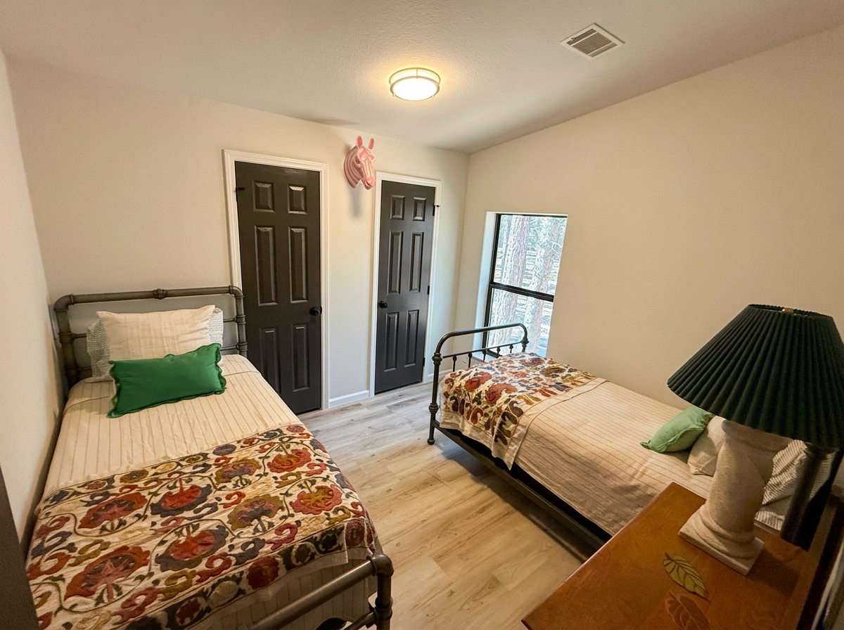 Third bedroom with two twin beds, ideal for kids, at Pine Tree Palace family cabin